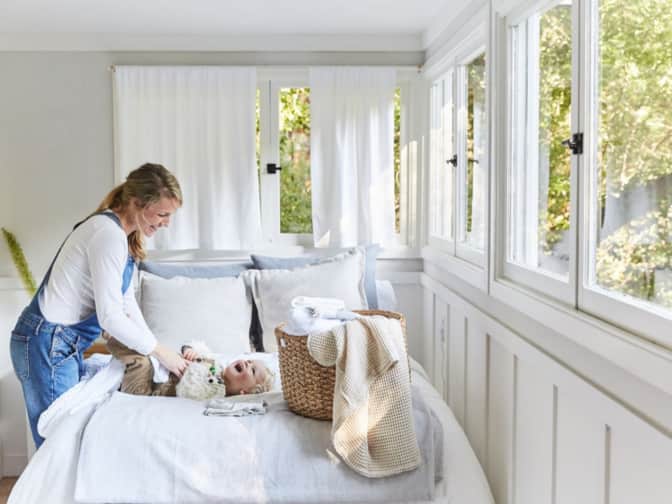 Image of a woman and a child in a bedroom
